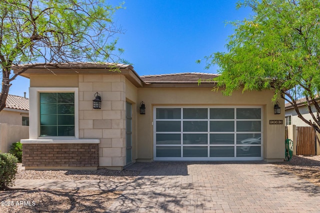 12083 W Peak View Rd, Peoria, AZ 85383 - view of front of home featuring decorative driveway, a garage, fence, and stucco siding