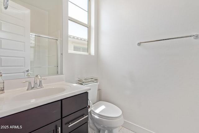 12083 W Peak View Rd, Peoria, AZ 85383 - full bath with a shower with shower door, toilet, vanity, and baseboards