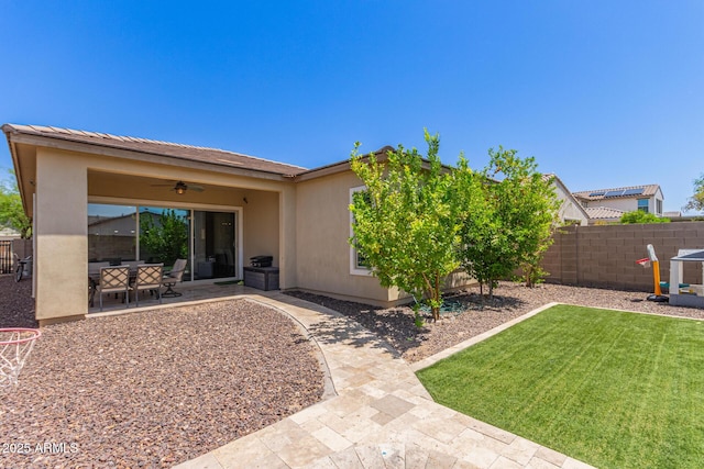12083 W Peak View Rd, Peoria, AZ 85383 - rear view of house with ceiling fan, a patio, and stucco siding