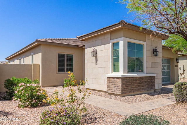12083 W Peak View Rd, Peoria, AZ 85383 - view of side of property featuring stucco siding, fence, and a tile roof