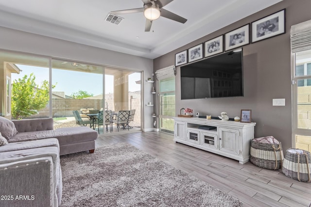 12083 W Peak View Rd, Peoria, AZ 85383 - living area with wood finished floors, a ceiling fan, plenty of natural light, and baseboards