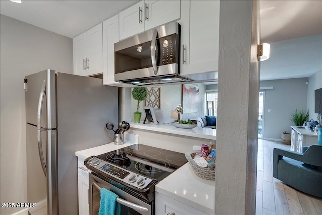 4620 N 68th St Unit 155, Scottsdale, AZ 85251 - kitchen featuring stainless steel appliances, light countertops, and white cabinets