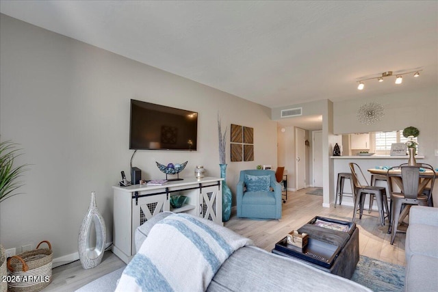 4620 N 68th St Unit 155, Scottsdale, AZ 85251 - living room featuring light wood-style floors and baseboards