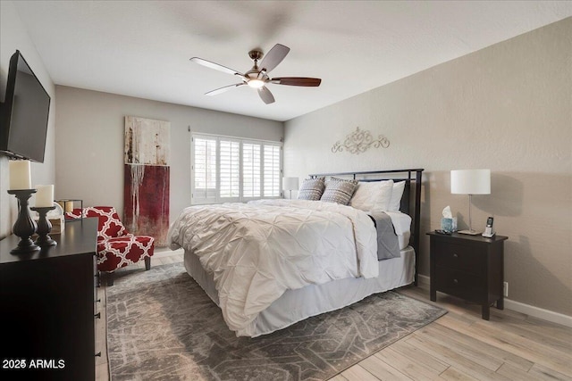 4620 N 68th St Unit 155, Scottsdale, AZ 85251 - bedroom with wood finished floors and a ceiling fan