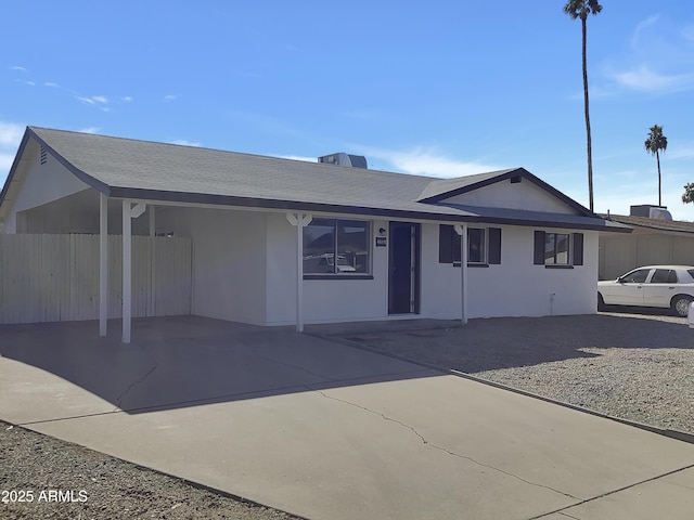 view of front of home with a carport