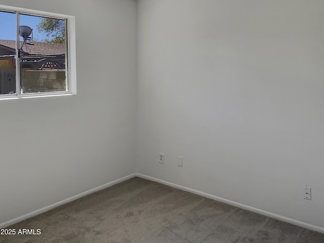 unfurnished room with light carpet