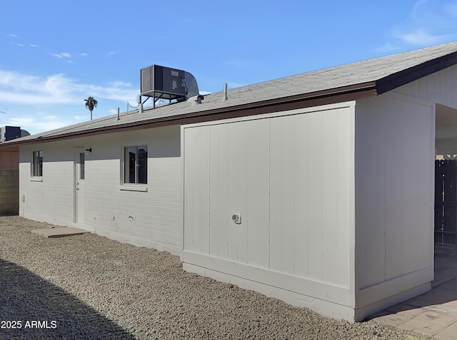 view of side of home featuring central AC