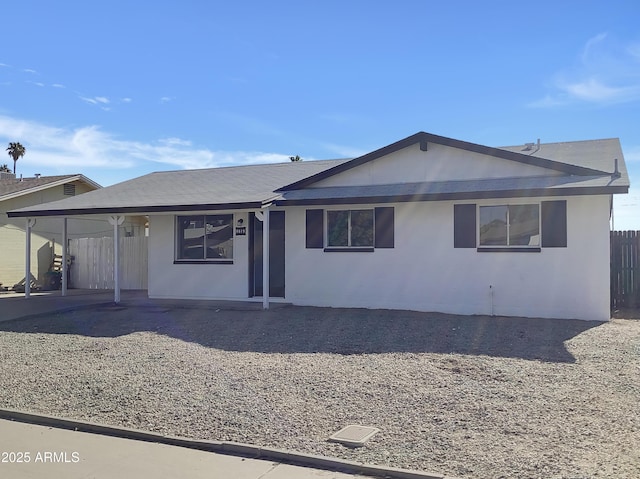 view of front of property with a carport