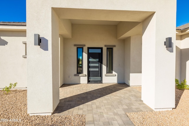 doorway to property with a patio area