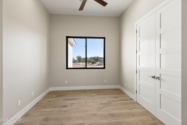 unfurnished bedroom with a closet, ceiling fan, and light hardwood / wood-style flooring