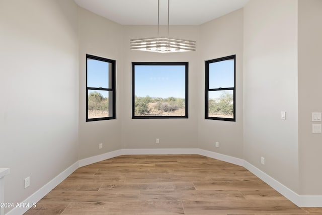 spare room featuring light hardwood / wood-style flooring