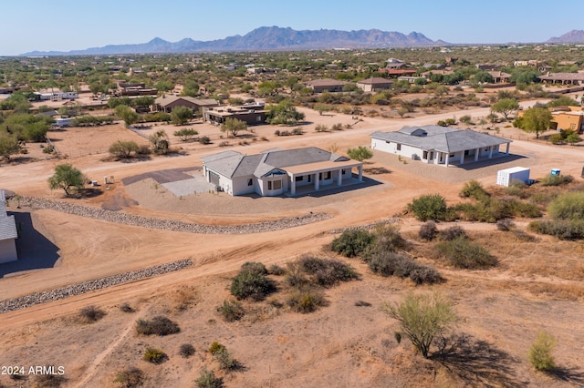 birds eye view of property with a mountain view