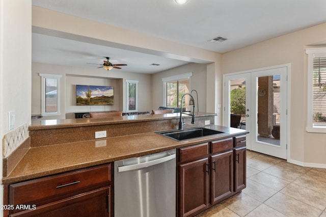 kitchen featuring visible vents, dishwasher, french doors, a sink, and light tile patterned flooring