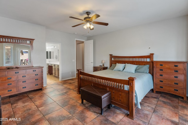 bedroom with ensuite bath and a ceiling fan