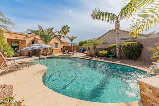 view of pool with a patio area, a fenced backyard, and a fenced in pool