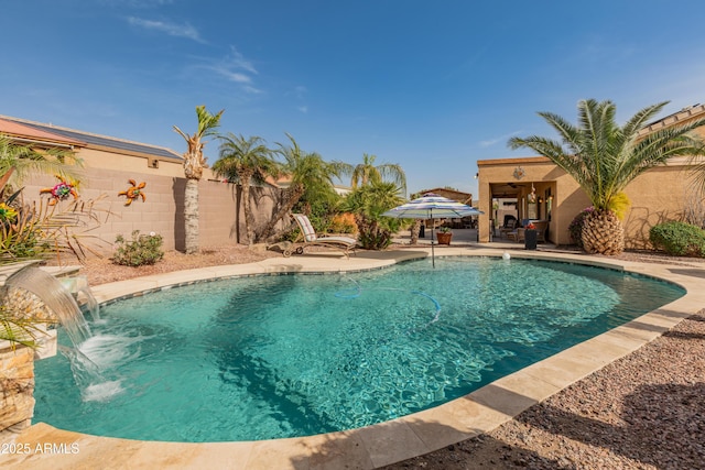 view of swimming pool featuring a patio area, a fenced backyard, and a fenced in pool