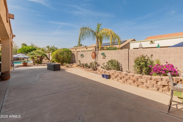 view of patio / terrace with a fenced backyard and a fenced in pool