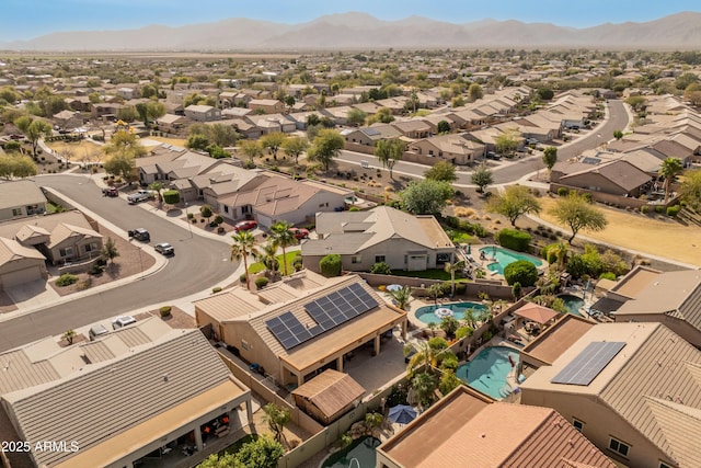 drone / aerial view featuring a residential view and a mountain view