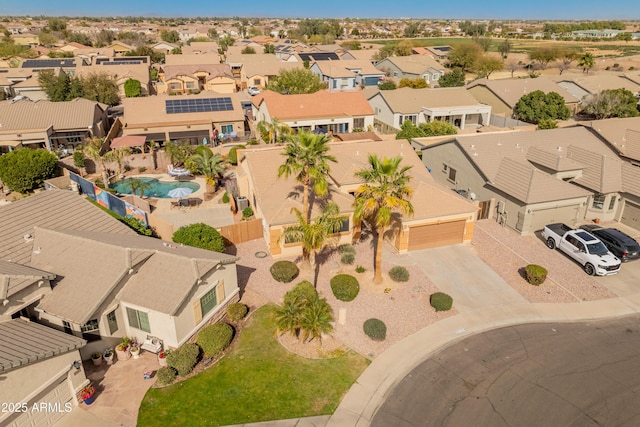 birds eye view of property with a residential view