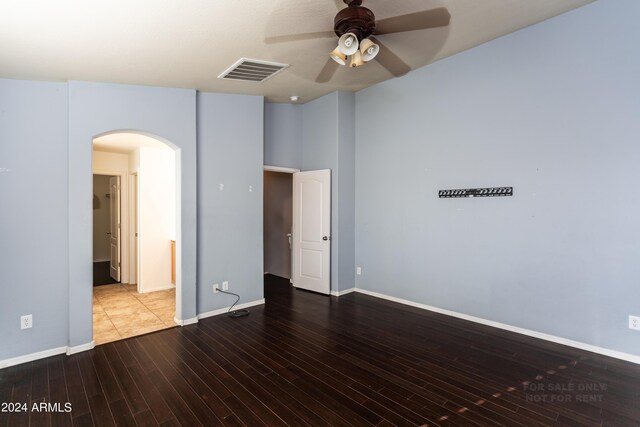 empty room featuring ceiling fan and hardwood / wood-style flooring