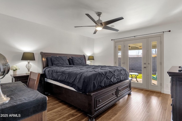 bedroom with ceiling fan, dark hardwood / wood-style flooring, access to outside, and french doors