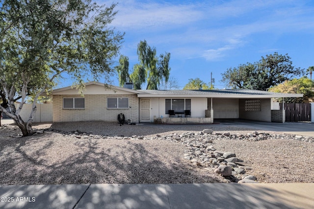 single story home with a carport