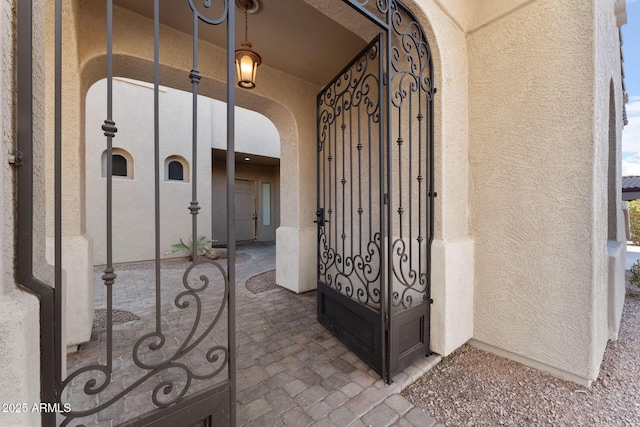 property entrance with stucco siding