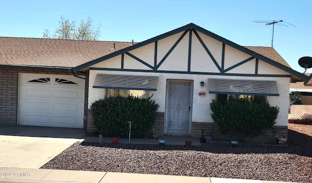 view of front of property with a garage