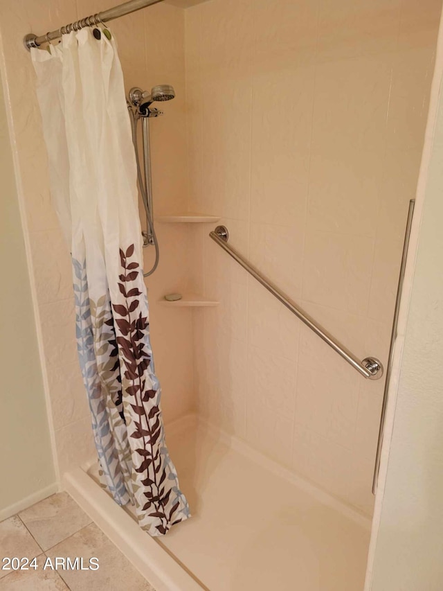 bathroom with tile patterned flooring and a shower with curtain