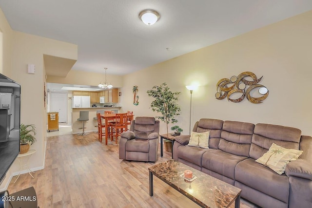 living room featuring light wood-type flooring and baseboards