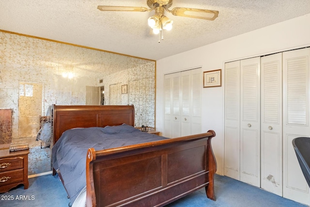 3410 W Pershing Ave, Phoenix, AZ 85029 - carpeted bedroom featuring multiple closets, a textured ceiling, and a ceiling fan