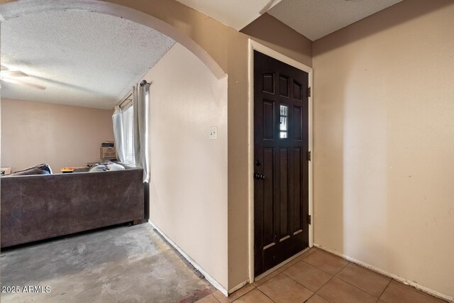 3410 W Pershing Ave, Phoenix, AZ 85029 - foyer with arched walkways, a textured ceiling, and baseboards