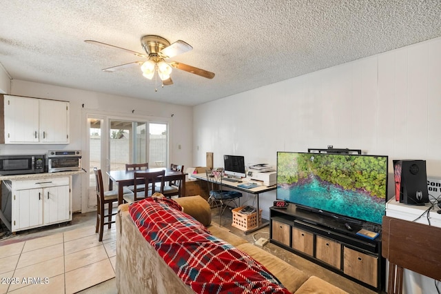 3410 W Pershing Ave, Phoenix, AZ 85029 - living area featuring a ceiling fan, a textured ceiling, and light tile patterned floors