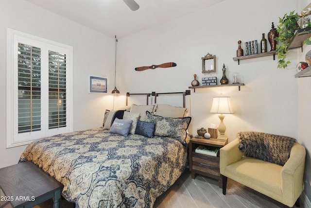 bedroom featuring hardwood / wood-style flooring and ceiling fan