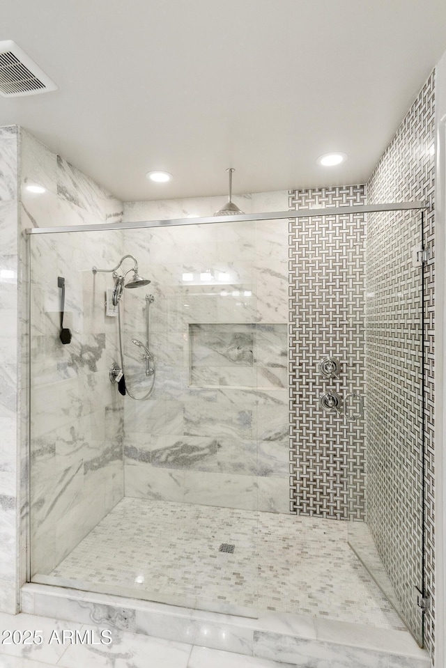 bathroom with an enclosed shower