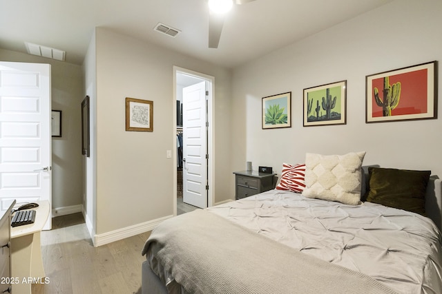 bedroom featuring light wood-type flooring and ceiling fan