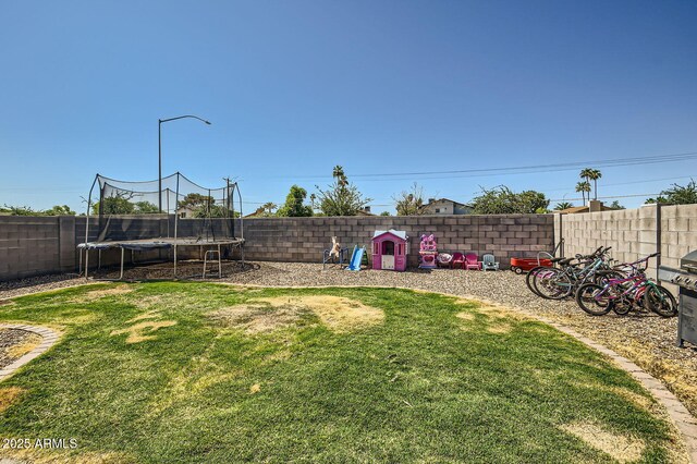 2955 E Flossmoor Ave, Mesa, AZ 85204 - fenced backyard featuring a trampoline