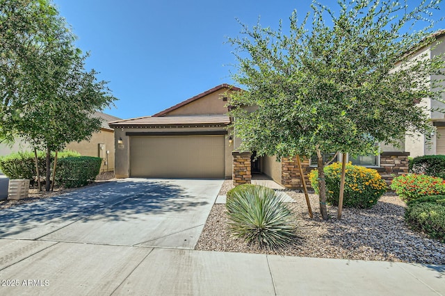 2955 E Flossmoor Ave, Mesa, AZ 85204 - obstructed view of property featuring stucco siding, an attached garage, concrete driveway, and a tiled roof