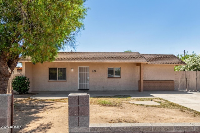 649 S Temple St, Mesa, AZ 85204 - view of front facade featuring stucco siding, a shingled roof, and mansard roof