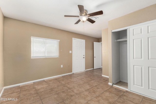 649 S Temple St, Mesa, AZ 85204 - unfurnished bedroom with a closet, light tile patterned floors, baseboards, and a ceiling fan
