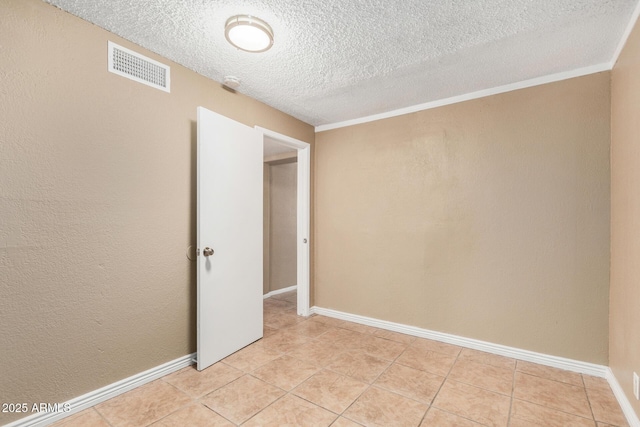 649 S Temple St, Mesa, AZ 85204 - unfurnished room featuring a textured ceiling, light tile patterned floors, baseboards, and a smoke detector