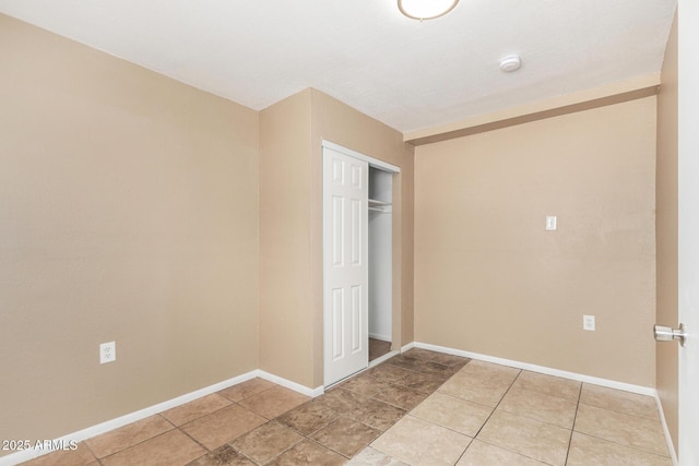 649 S Temple St, Mesa, AZ 85204 - unfurnished bedroom featuring a closet and baseboards