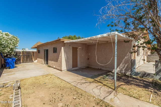 649 S Temple St, Mesa, AZ 85204 - back of property featuring stucco siding and a patio