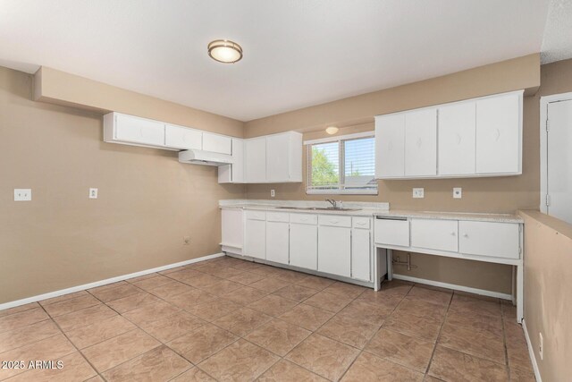 649 S Temple St, Mesa, AZ 85204 - kitchen featuring a sink, light countertops, white cabinets, baseboards, and under cabinet range hood