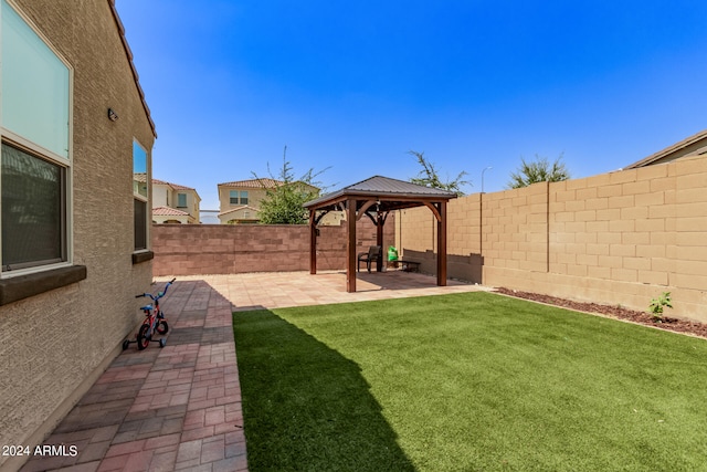 view of yard featuring a patio area and a gazebo