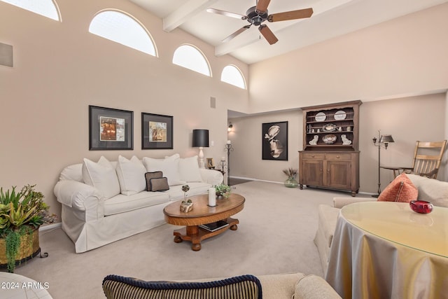 carpeted living room featuring beamed ceiling, ceiling fan, and high vaulted ceiling