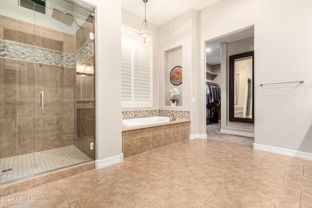 bathroom featuring independent shower and bath