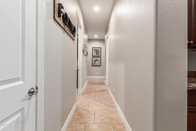 hallway featuring light tile patterned floors