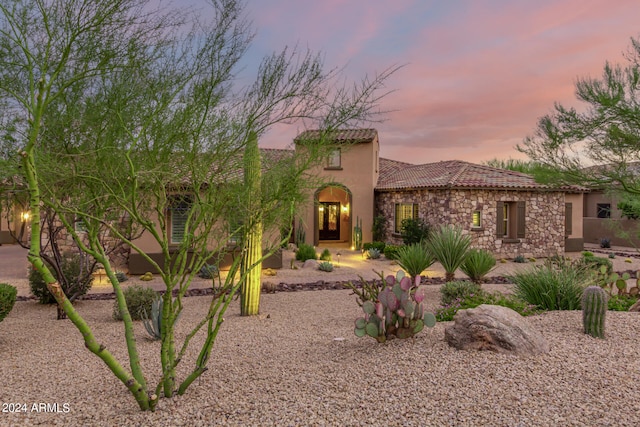 mediterranean / spanish-style house with a patio