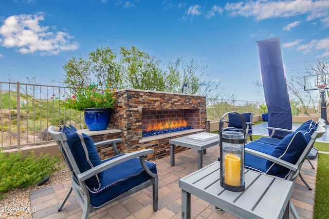 view of patio / terrace with an outdoor fireplace